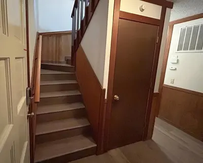 a stairway with a wooden door and a stair case at Brookstone Pines home in Incline Village