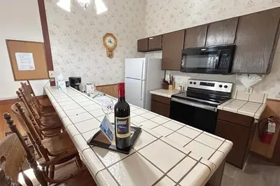 a kitchen with a table with a bottle of wine on it at Brookstone Pines home in Incline Village