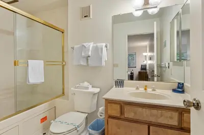 a bathroom with a sink and a toilet and a shower at Heavenly Chairview Condo home in Stateline