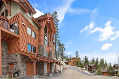 a large wooden house with a balcony at Stage Coach Run home in Stateline