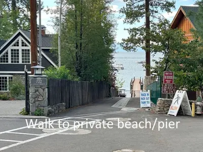 a walk to paradise beach sign in front of a house at Foothill Folly home in Zephyr Cove