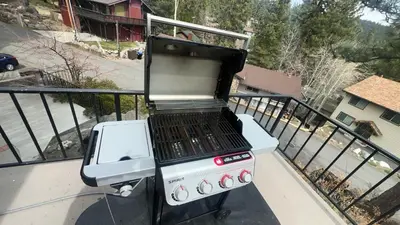 a grill sitting on top of a balcony at The Heights home in Zephyr Cove