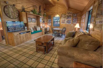 a living room with a couch and a table at Smokey Joes cabin in Zephyr Cove