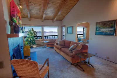 a living room with a couch and a table at Lake View Glen home in Lincoln Park