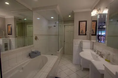 a bathroom with two sinks and a tub and a shower at Chipmunk's Paradise condo in Kings Beach