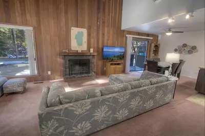 a living room with a couch and a fireplace at Sparrow's Nest home in Incline Village