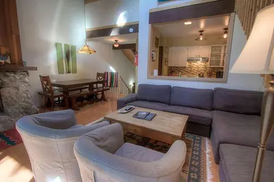 a living room with a couch and chairs and a table at Alpine Getaway home in Tahoe City