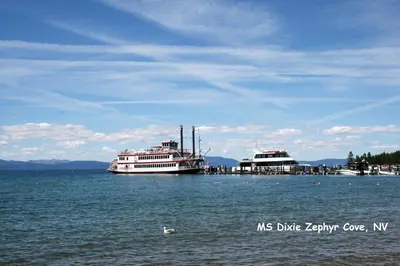 two boats are docked at a dock in the water at Tahoe Olympic condo in Stateline