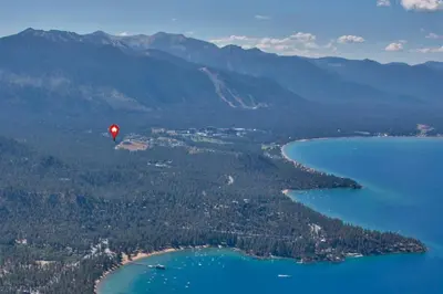a red hot air balloon flying over a body of water at Chimney Rock Condo condo in Stateline