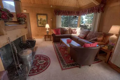 a living room with a couch and a fireplace at Chimney Rock Condo condo in Stateline