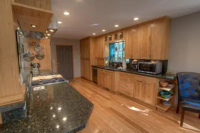 a kitchen with wooden cabinets and a counter top at Gale Force Wind home in Incline Village