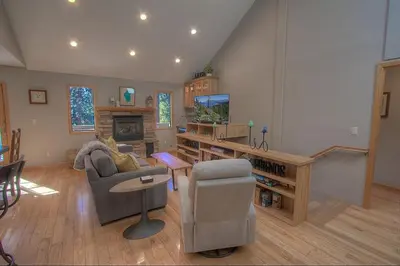 a living room with a couch and chairs and a television at Gale Force Wind home in Incline Village
