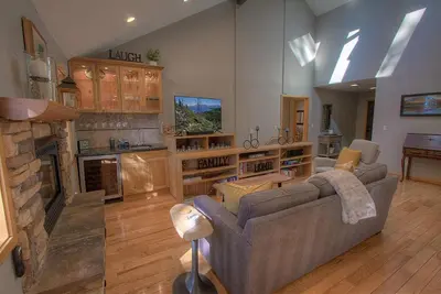 a living room with a couch and a fireplace at Gale Force Wind home in Incline Village