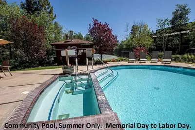 a swimming pool with a hot tub and a hot tub at Park View Paradise condo in Tahoe City