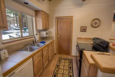 a kitchen with a sink and a counter top at Whispering Wood home in Incline Village