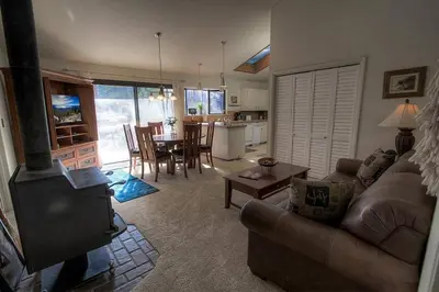 a living room with a couch and a stove at Blue Laulea home in Incline Village