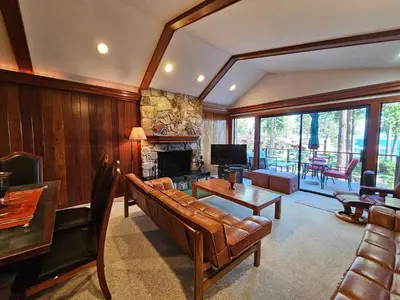 a living room with a couch and a fireplace at Brockway Beachside Bungalo home in Kings Beach