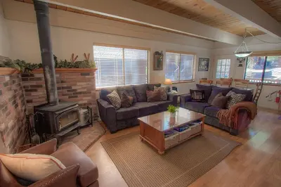 a living room with a couch and a fireplace at Cozy Mountain Hideaway home in Incline Village