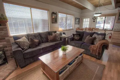 a living room with a couch and a coffee table at Cozy Mountain Hideaway home in Incline Village