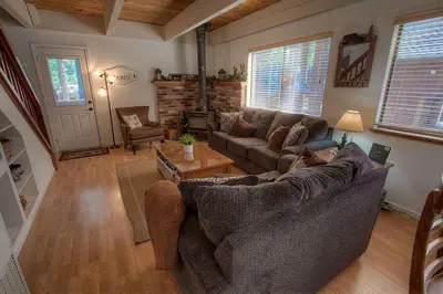 a living room with a couch and a table at Cozy Mountain Hideaway home in Incline Village
