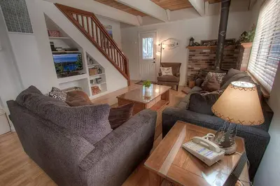 a living room with two couches and a table at Cozy Mountain Hideaway home in Incline Village