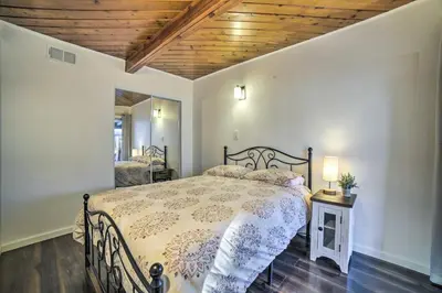 a bedroom with a bed and a wooden ceiling at Gateway to Mt Rose Ski! Reno Home with Fireplace in Reno
