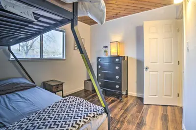 a bedroom with a bunk bed and a dresser at Gateway to Mt Rose Ski! Reno Home with Fireplace in Reno