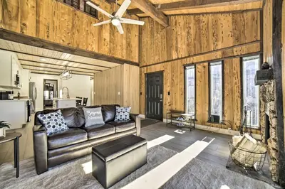 a living room with a couch and a ceiling fan at 1 Mi to Lake Tahoe Vacation Rental Home! in Stateline