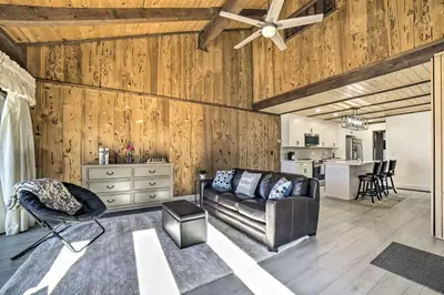 a living room with a couch and a ceiling fan at 1 Mi to Lake Tahoe Vacation Rental Home! in Stateline
