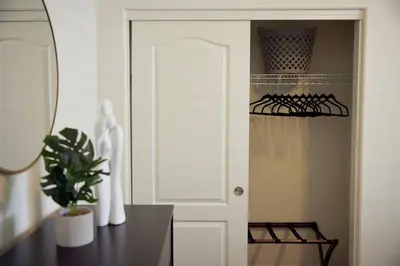 a closet with a white door and a black table at NEW Upscale House, Tahoe 30-min w/ Cal King in Steamboat