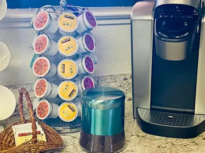 a kitchen counter with a coffee maker and a wall of cupcakes at Family friendly, 3 bedroom house, with king bed for up to 15 - BBQ - Internet - jet tub in Auburn