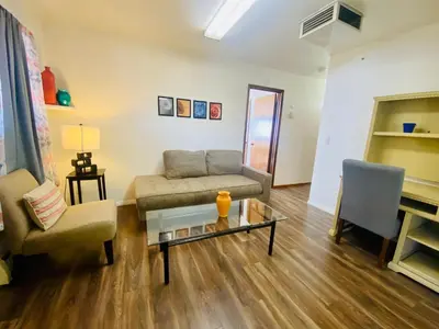 a living room with a couch and a table at Family friendly, 3 bedroom house, with king bed for up to 15 - BBQ - Internet - jet tub in Auburn