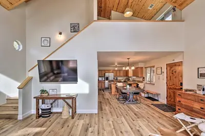 a large living room with a dining room and kitchen at Near Hiking and Wineries Arnold Cabin with Deck! in Arnold