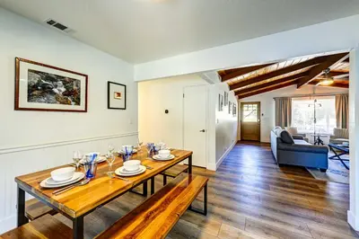 a living room with a table and a couch at Dog-Friendly Oakhurst Home Walk to Downtown! in Oakhurst
