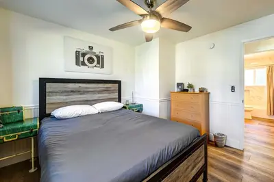 a bedroom with a bed and a ceiling fan at Dog-Friendly Oakhurst Home Walk to Downtown! in Oakhurst