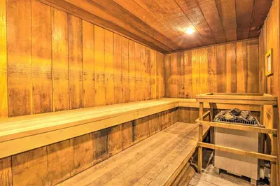 an empty wooden sauna with a wood paneled wall at Mammoth Lakes Condo with Pool and Spa Access! in Mammoth Lakes