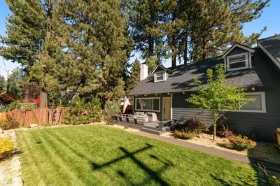 a house with a yard with a cross on the grass at The Home at the End of the Rainbow in South Lake Tahoe