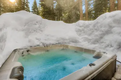a hot tub covered in snow with snow at North Star Mountain Retreat in Truckee