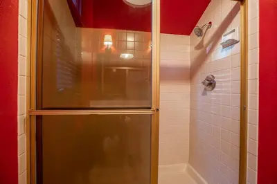 a shower with a glass door in a bathroom at Townhouse Art Gallery in Mammoth's Best Location in Mammoth Lakes