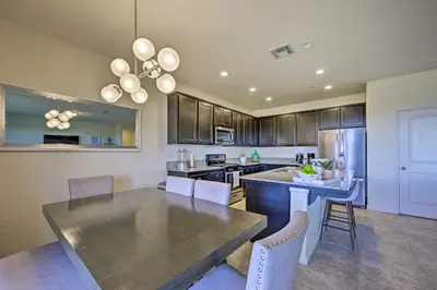 a kitchen with a table and a dining room at Visalia Home with Yard 4 Mi to Downtown! in Visalia