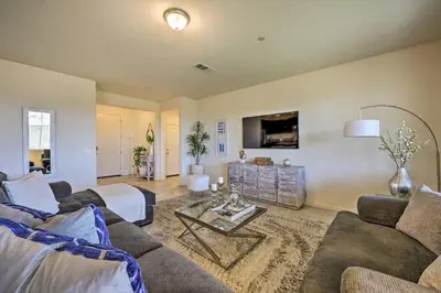 a living room with two couches and a tv at Visalia Home with Yard 4 Mi to Downtown! in Visalia