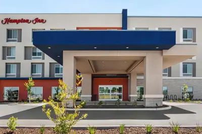 a hospital building with a blue roof at Hampton Inn Stockton, Ca in Stockton