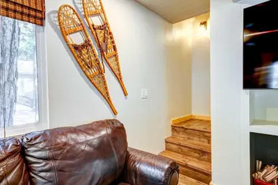 a leather couch sitting in a living room with a tv at Hike, Fish and Explore California Cabin with Deck! in Long Barn