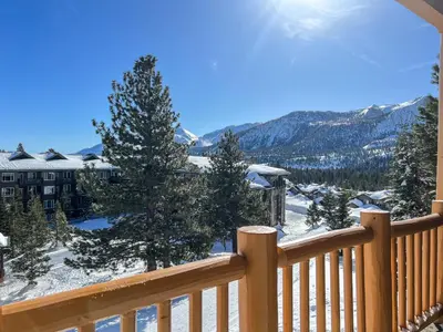 a view from the balcony of a resort in the snow at Sunstone #231 condo in Mammoth Lakes