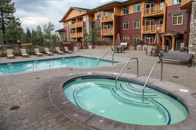a swimming pool in front of a apartment complex at Sunstone #231 condo in Mammoth Lakes