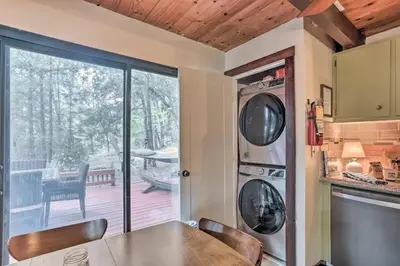 a kitchen with a table and chairs and a patio at Peaceful Oak Haven Cabin near Yosemite in Mariposa