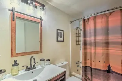 a bathroom with a sink and a shower at Peaceful Oak Haven Cabin near Yosemite in Mariposa
