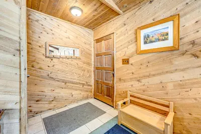 a log cabin with a bench in a room at The Big White Cottage in Truckee