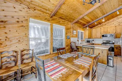 a dining room and kitchen with a table and chairs at The Big White Cottage in Truckee