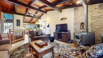 a living room with a couch and a fireplace at Mammoth Estates #140 condo in Mammoth Lakes